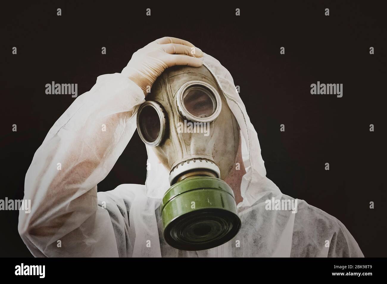 virus infection concept. Man in protective suit and antigas mask on dirty  black background. Ebola, toxic gases, biological warfare, coronavirus,  infec Stock Photo - Alamy