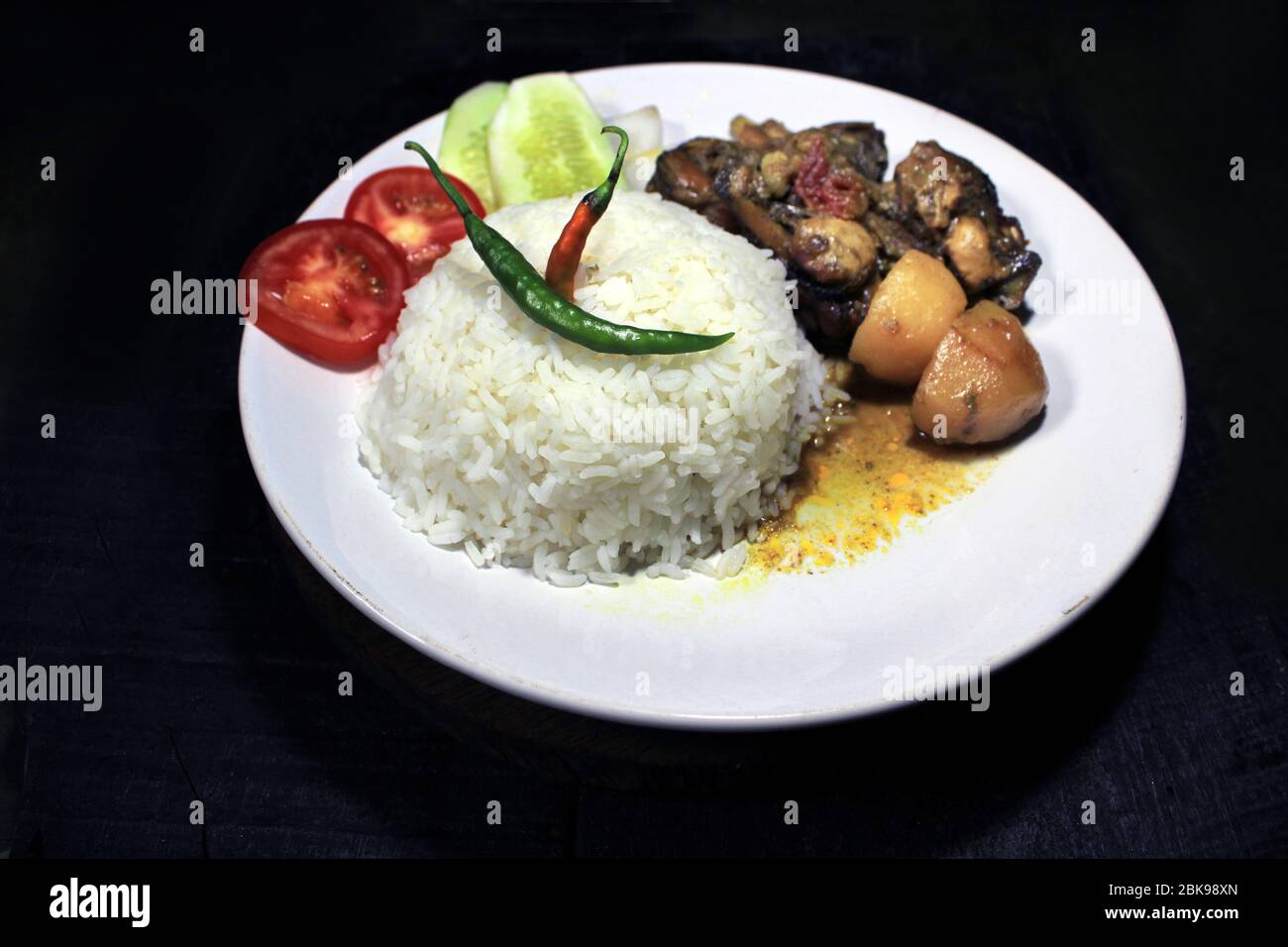 Cup Of Boiled Rice With Chicken Broth On A White Plate Isolated On Black Background Cooked Rice On A White Plate Chili Tomato Cucumber Stock Photo Alamy Cup Of Boiled Rice With Chicken Broth On A White Plate Isolated On Black Background Cooked Rice On A White Plate Chili Tomato Cucumber Stock Photo Alamy