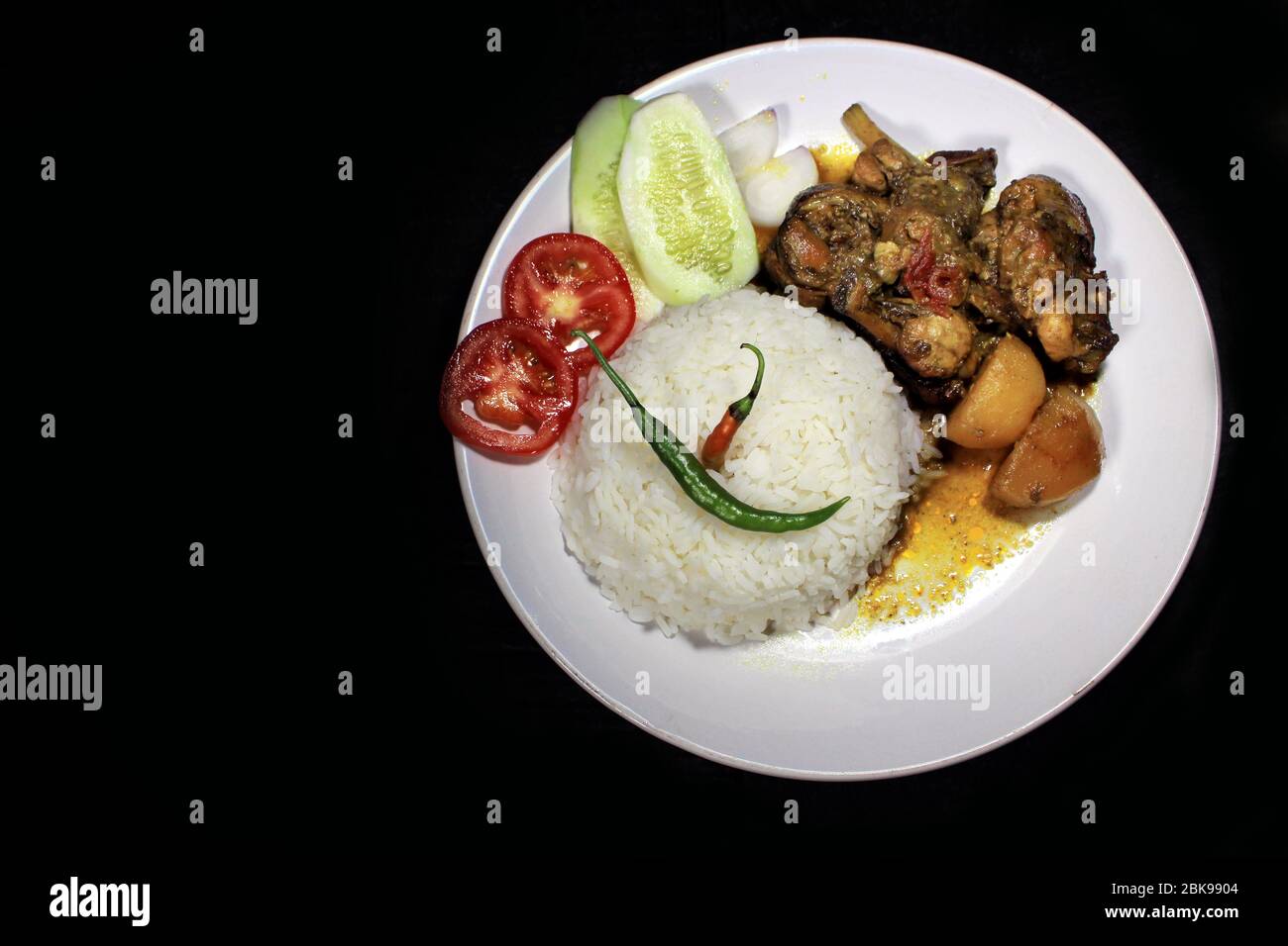 Cup Of Boiled Rice With Chicken Broth On A White Plate Isolated On Black Background Cooked Rice On A White Plate Chili Tomato Cucumber Stock Photo Alamy Cup Of Boiled Rice With Chicken Broth On A White Plate Isolated On Black Background Cooked Rice On A White Plate Chili Tomato Cucumber Stock Photo Alamy