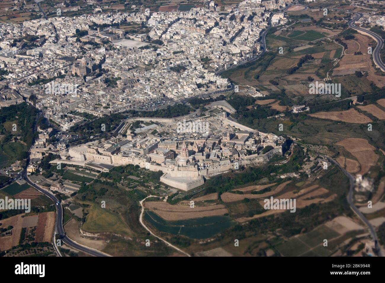 The historic walled city of Mdina and neighbouring town Rabat in Malta, as seen from the air. Travel in Europe. Aerial view. Stock Photo