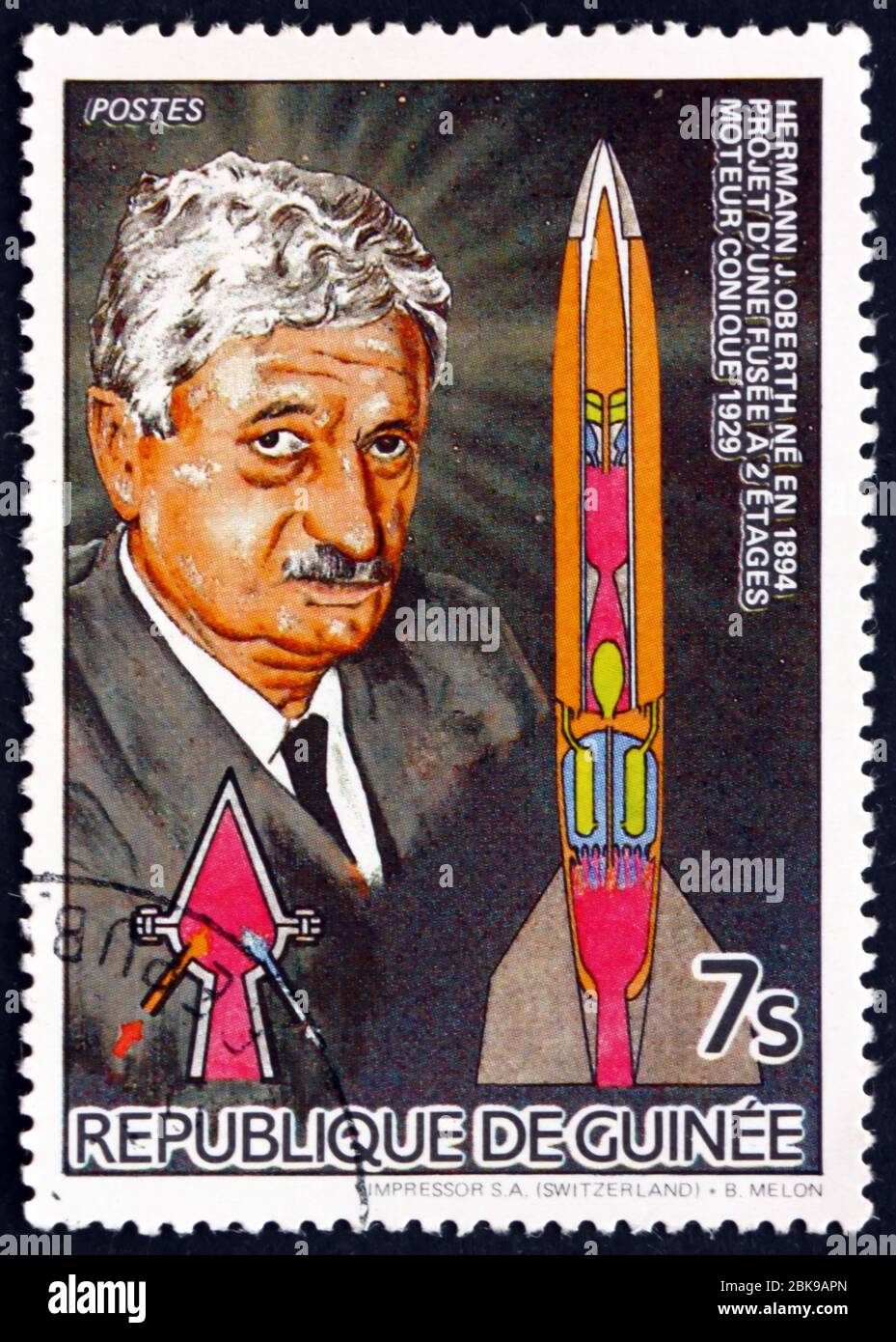 GUINEA - CIRCA 1985: a stamp printed in Guinea shows Scientist Hermann J. Oberth, German Physicist and Engineer, and Two-stage Rocket, circa 1985 Stock Photo