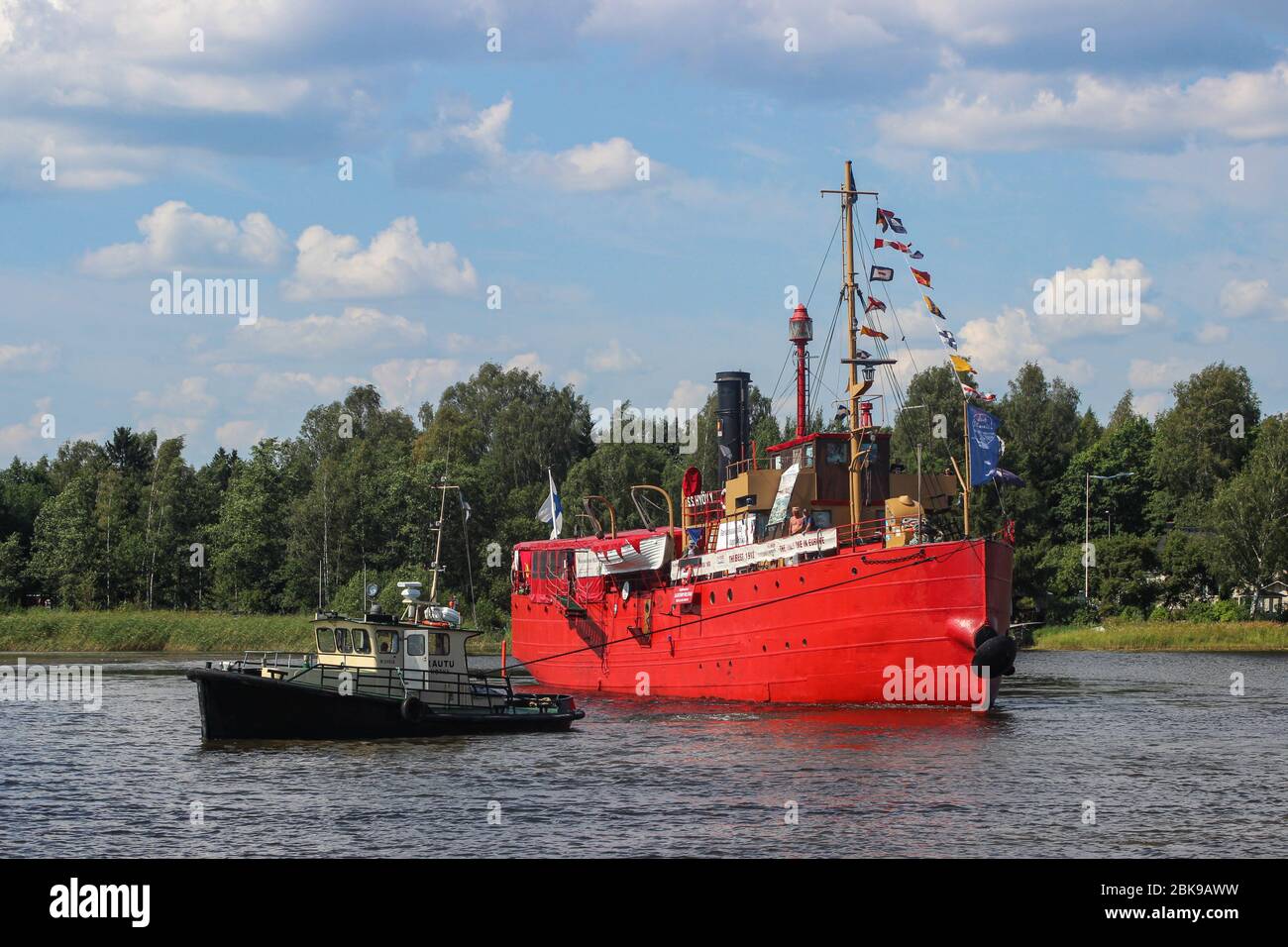 Tugboat Rautu towing S/S Hyöky - former lightship Helsinki - in Hamina, Finland Stock Photo