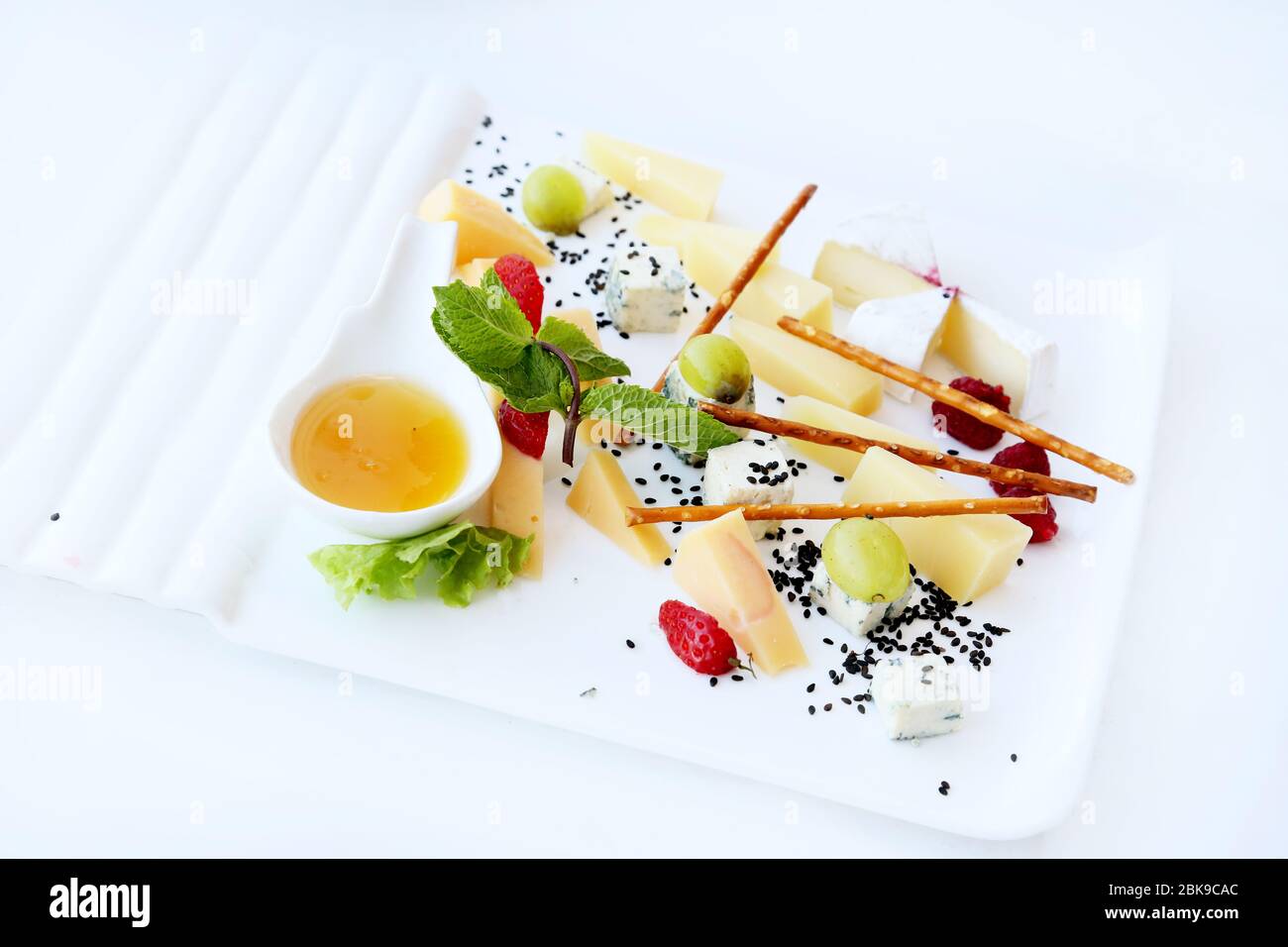Cheese snacks on banquet table Stock Photo - Alamy