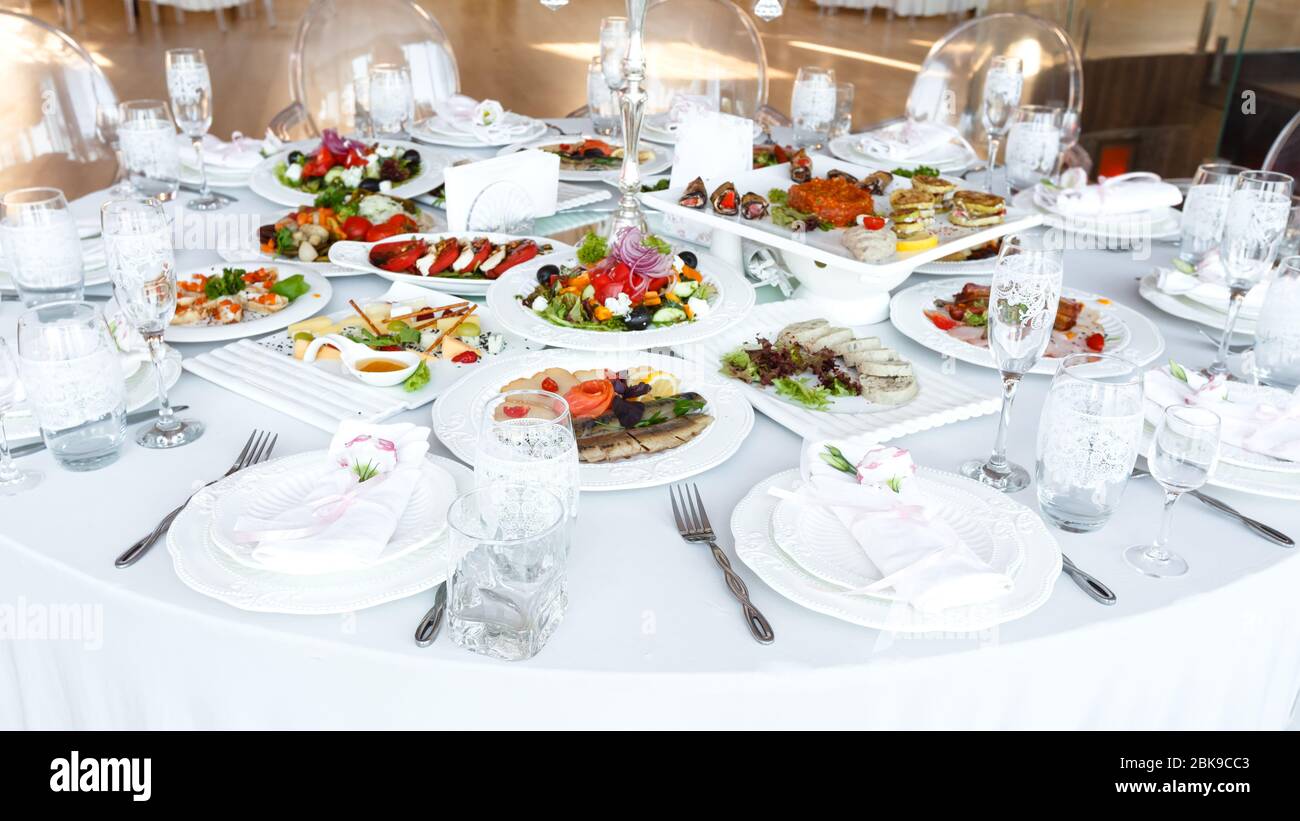 Reception Tableware Elegant decorated table with meal and tableware at wedding reception ...