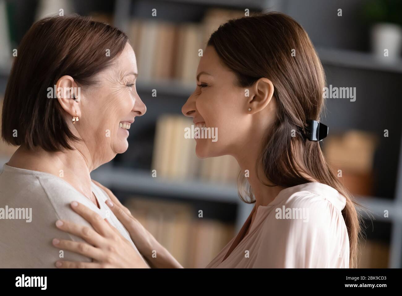 Happy middle aged mother and adult daughter having fun Stock Photo