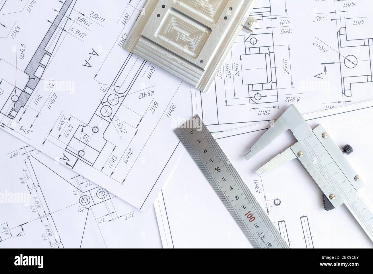 Top view of a caliper measuring tool, ruler and detail drawings