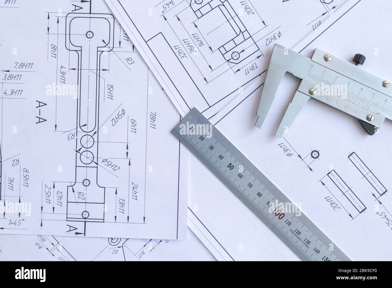 Top view of a caliper measuring tool, ruler and detail drawings