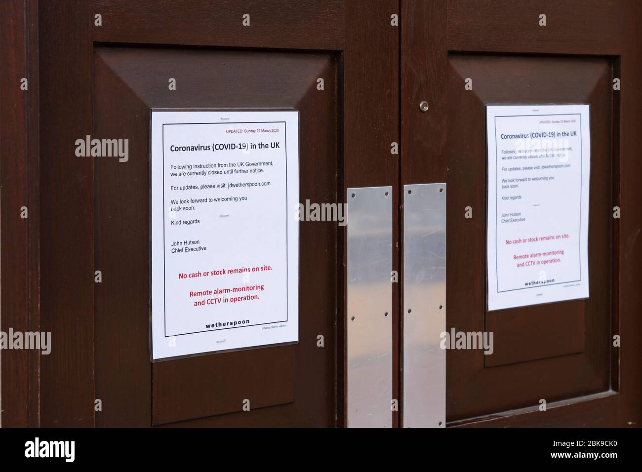 A notice on the entrance doors to Wetherspoons pub about following government guidance to close during the Coronavirus Covid 19 Pandemic. May 2020. UK Stock Photo