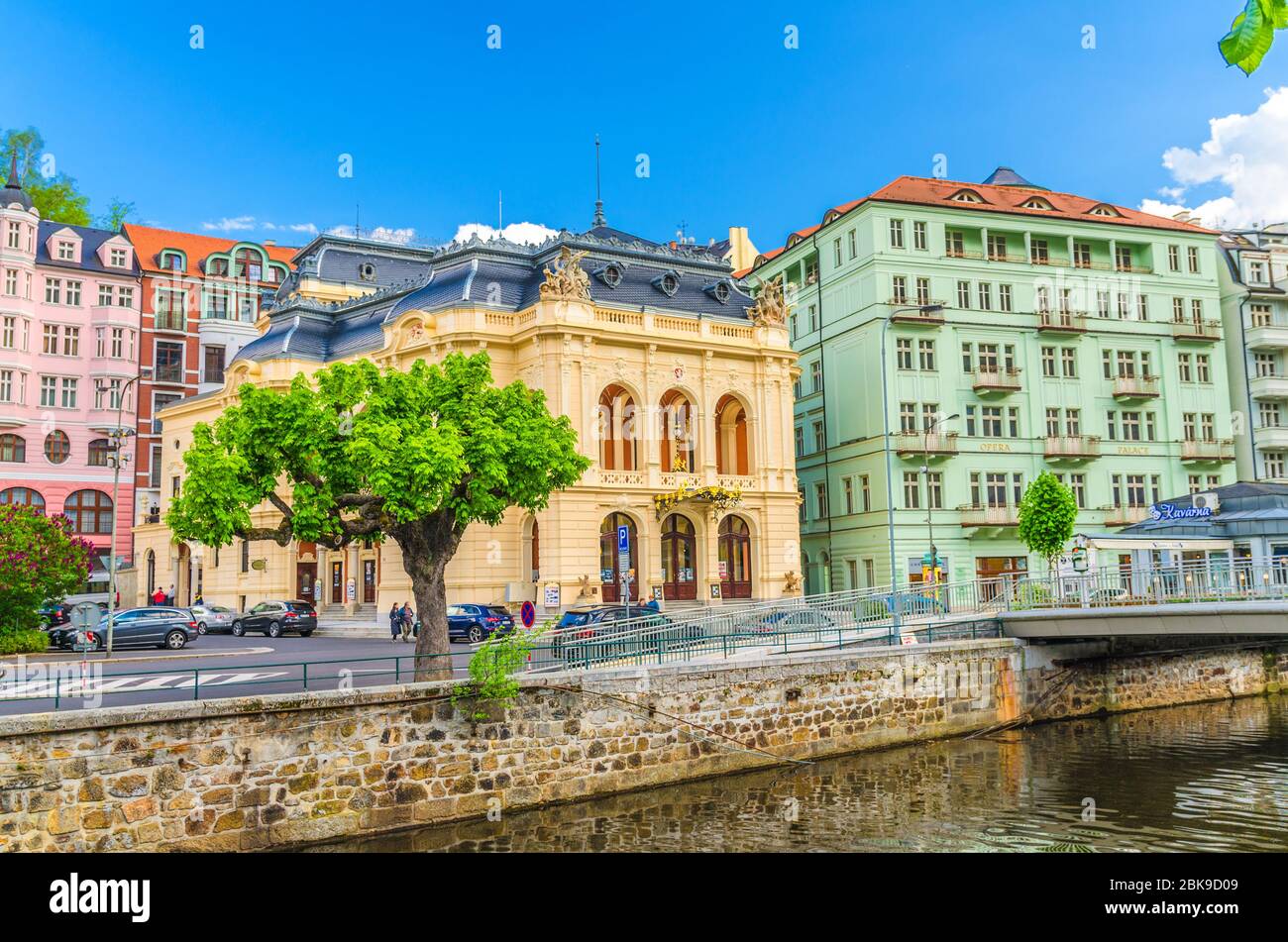 Karlovy Vary, Czech Republic, May 10, 2019: Municipal Theatre Neo-Baroque building at Theatre Square in Carlsbad historical city centre, Tepla river embankment, colorful buildings, West Bohemia Stock Photo