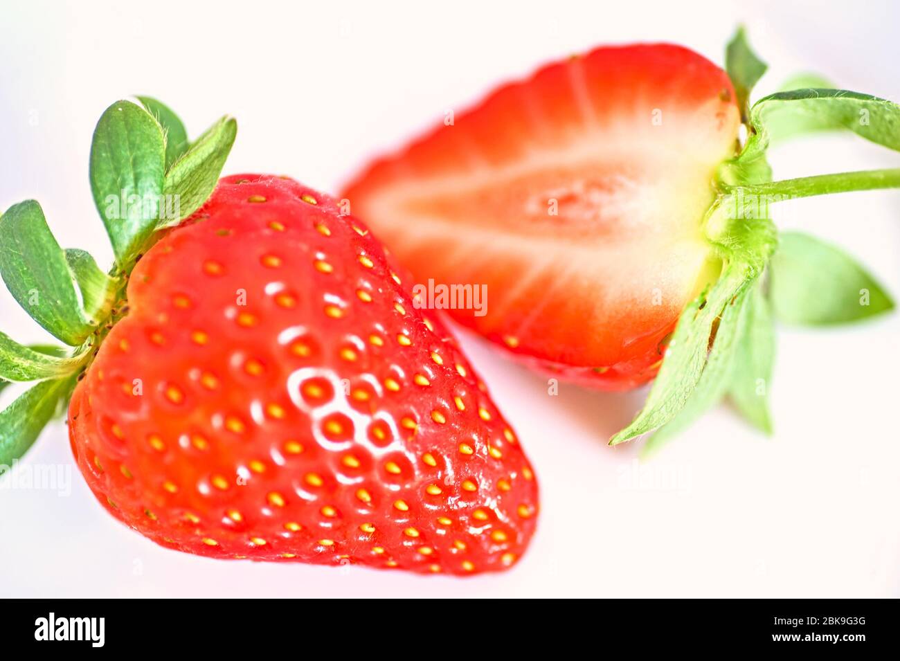 Strawberries in half hi-res stock photography and images - Alamy