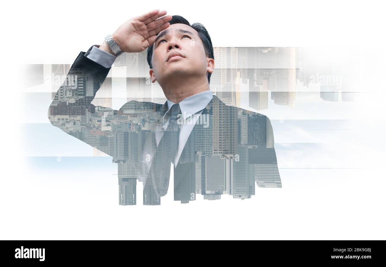 Double exposure - Business leader vision for success, looking away with modern buildings in city background. Concept of talented leadership. Stock Photo