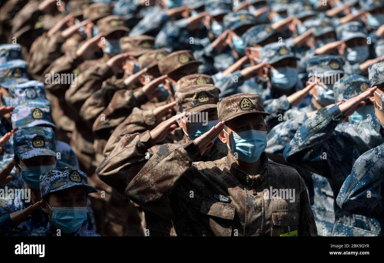 Beijing, China's Hubei Province. 15th Apr, 2020. Military medics salute to the Huoshenshan Hospital in Wuhan, central China's Hubei Province, April 15, 2020. Credit: Fei Maohua/Xinhua/Alamy Live News Stock Photo