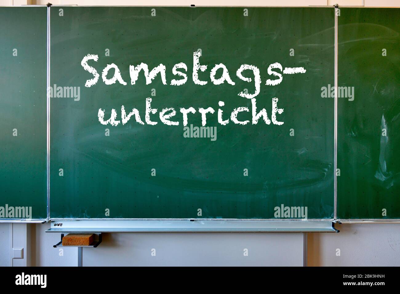 Blackboard with inscription SAMSTAGSUNTERRICHT, Corona crisis, Germany Stock Photo