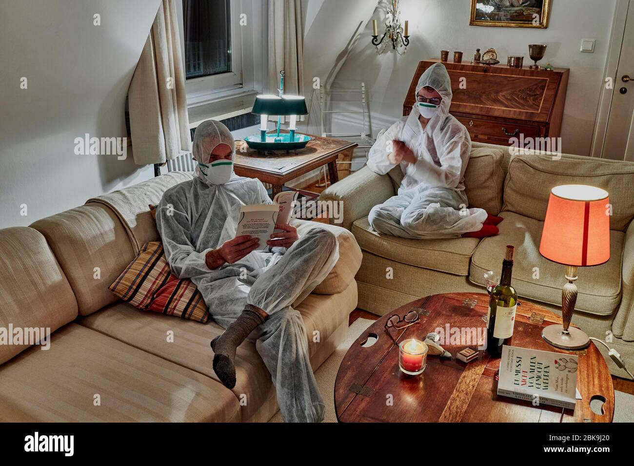 Married couple in protective clothing during the corona crisis, Sylt, Germany Stock Photo