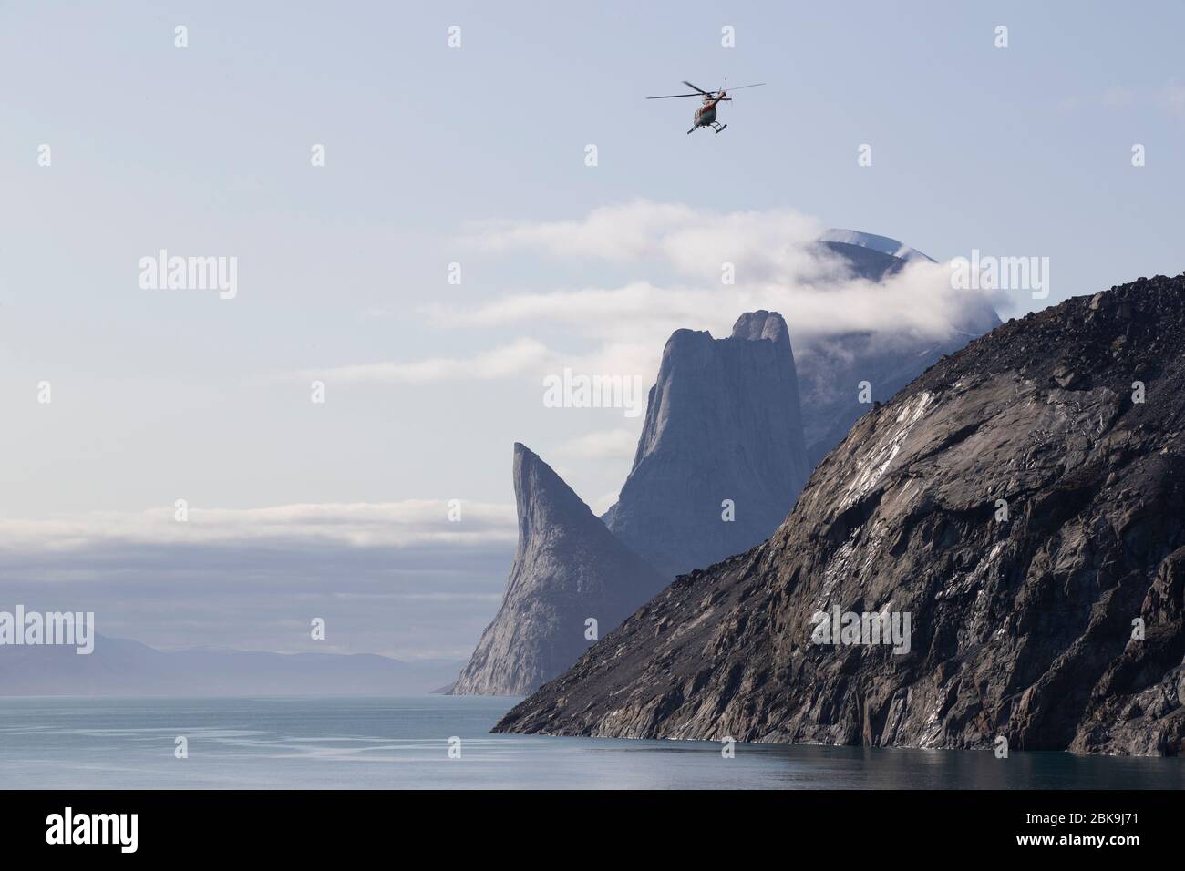 Helicopter and dramatic landscape, Sam Ford Fjord, Canada Stock Photo