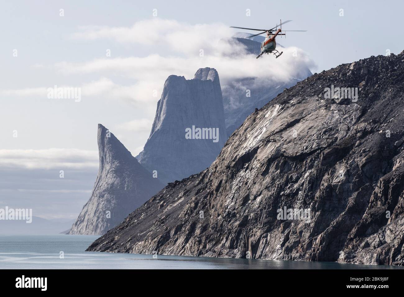 Helicopter and dramatic landscape, Sam Ford Fjord, Canada Stock Photo