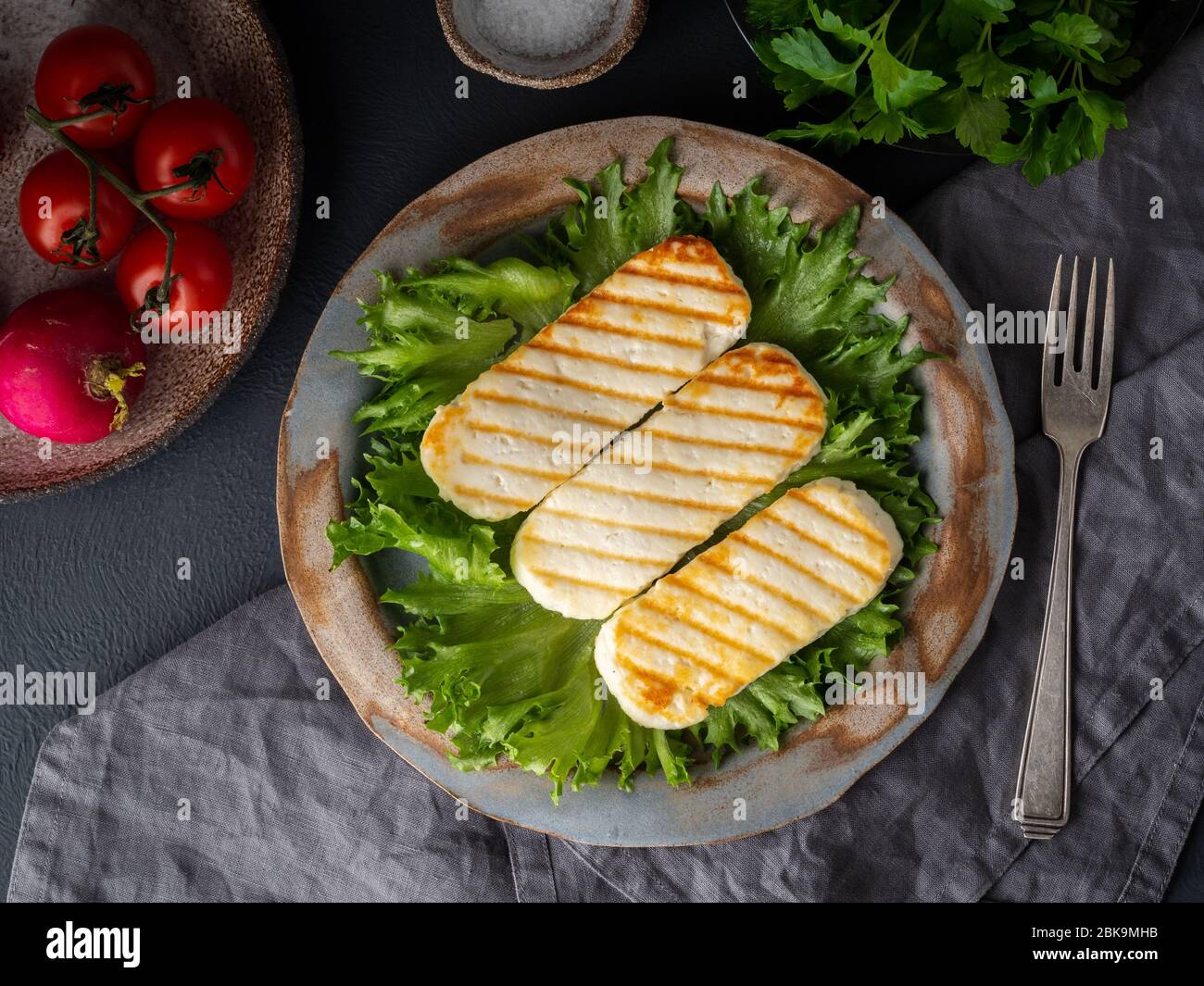 Grilled Halloumi, fried cheese with lettuce salad. Balanced diet on