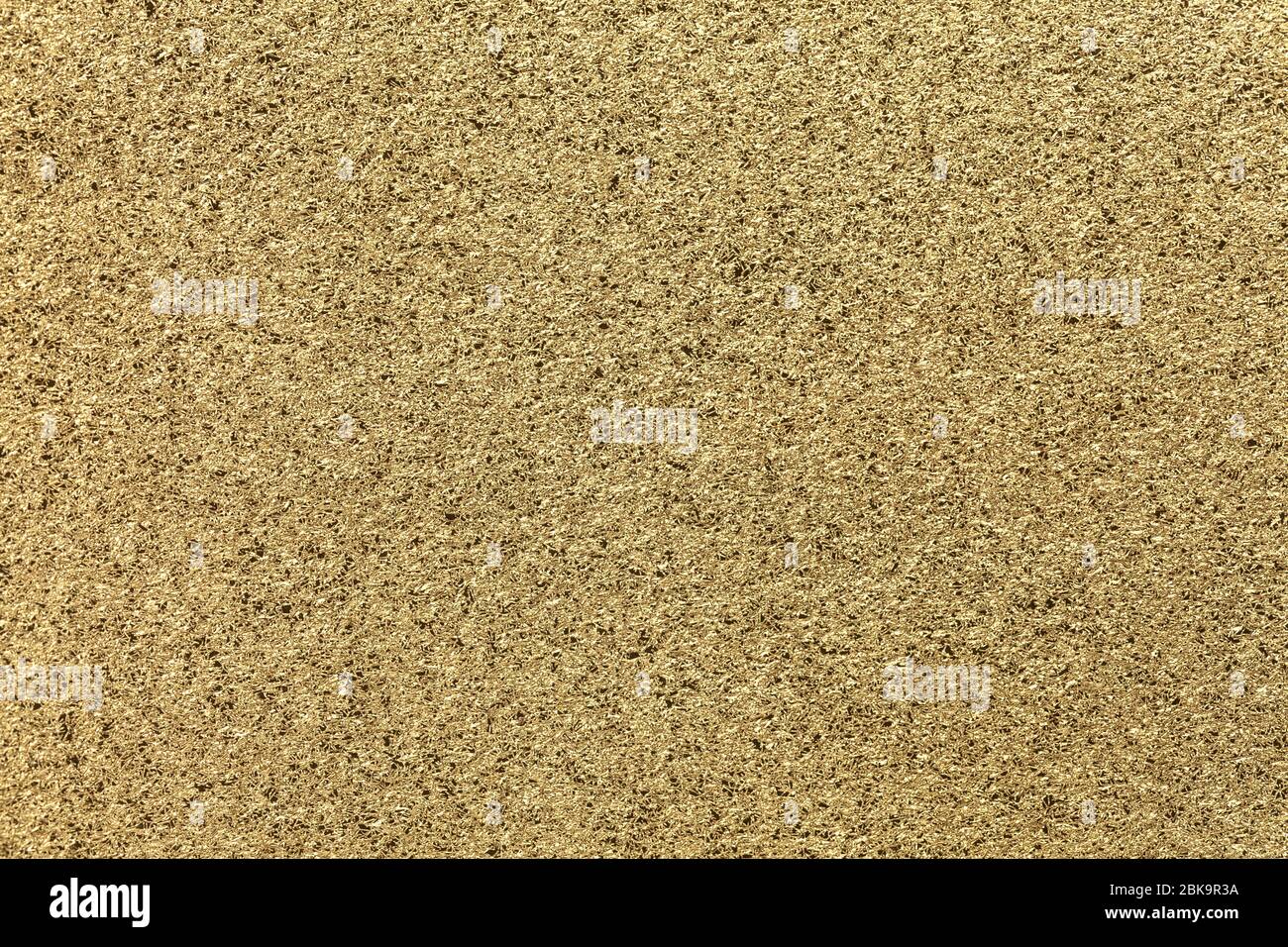 Golden sparkling background from small sequins, closeup. Yellow ...