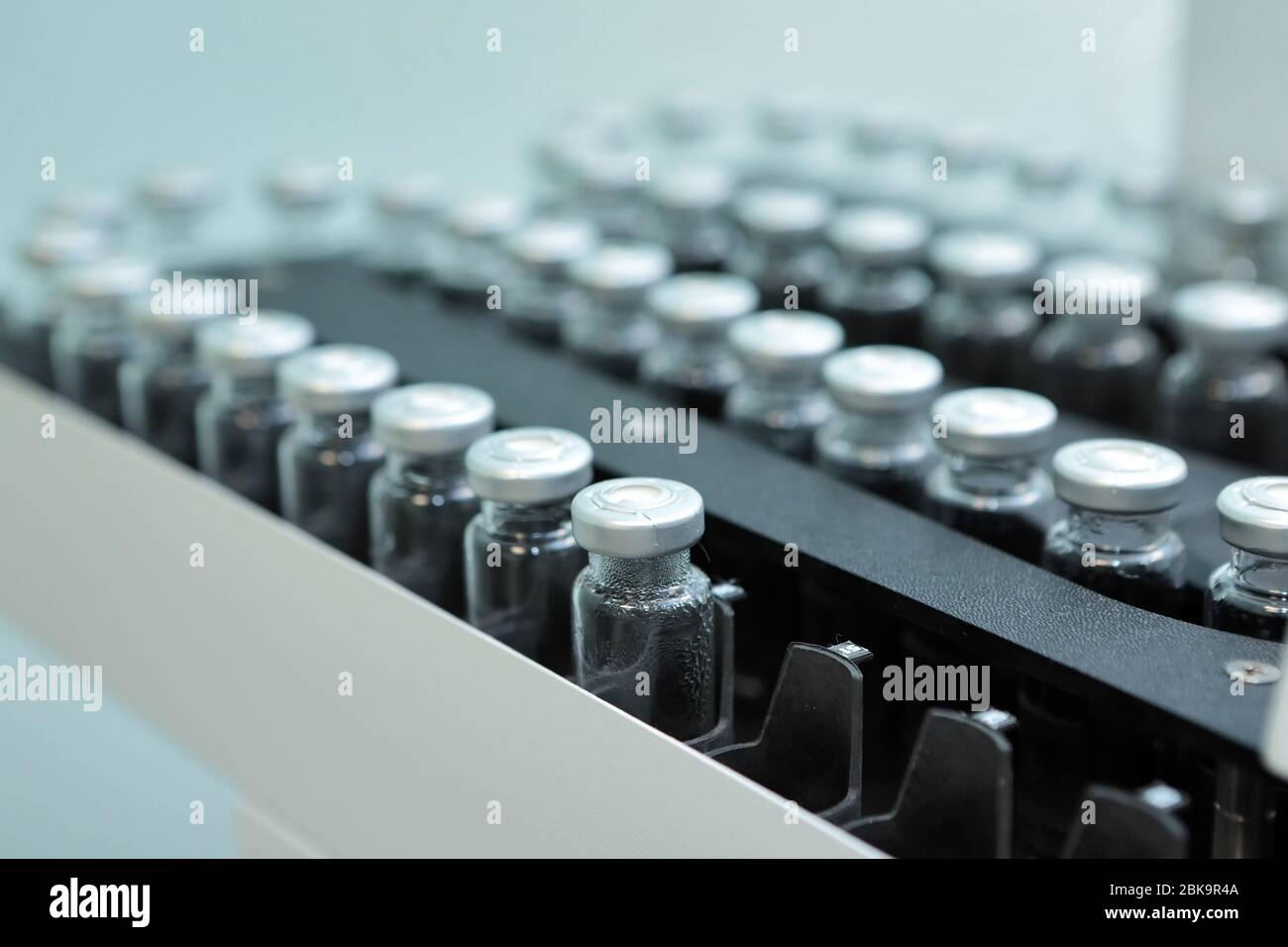 Sterile bottles and ampoules on the dispensing line. Sealed ampoules