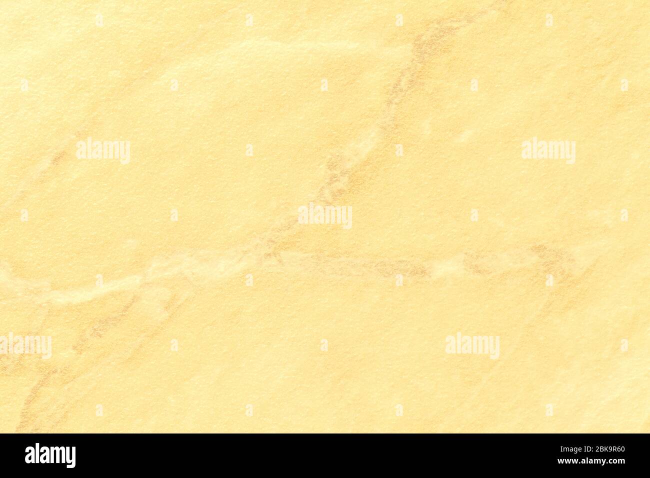 Texture of light yellow marble with golden lines of a pattern, macro