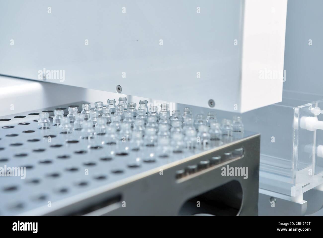 Sterile bottles and ampoules on the dispensing line. Sealed ampoules