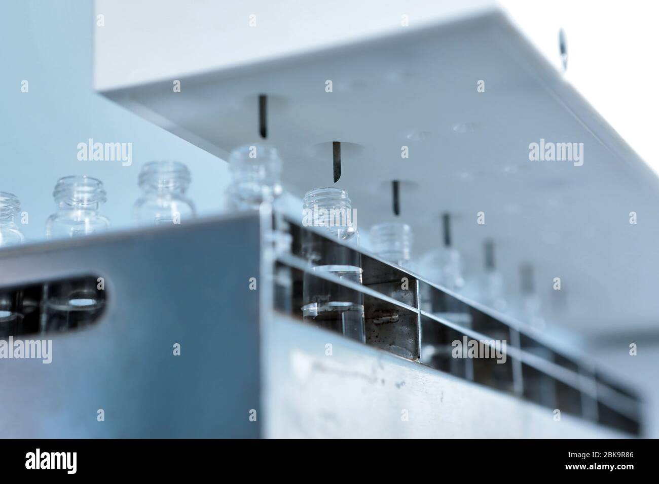 Sterile bottles and ampoules on the dispensing line. Sealed ampoules