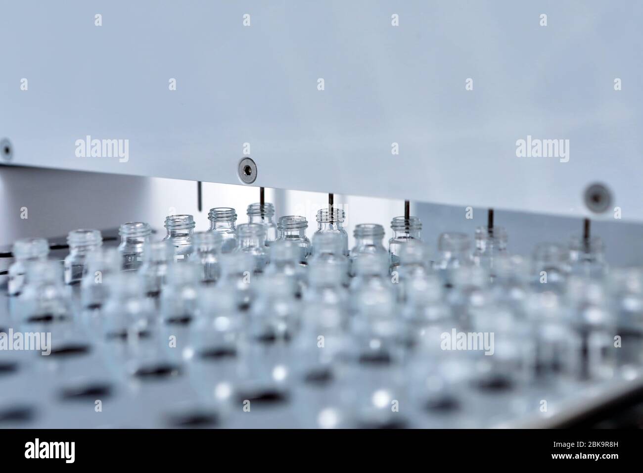 Sterile bottles and ampoules on the dispensing line. Sealed ampoules