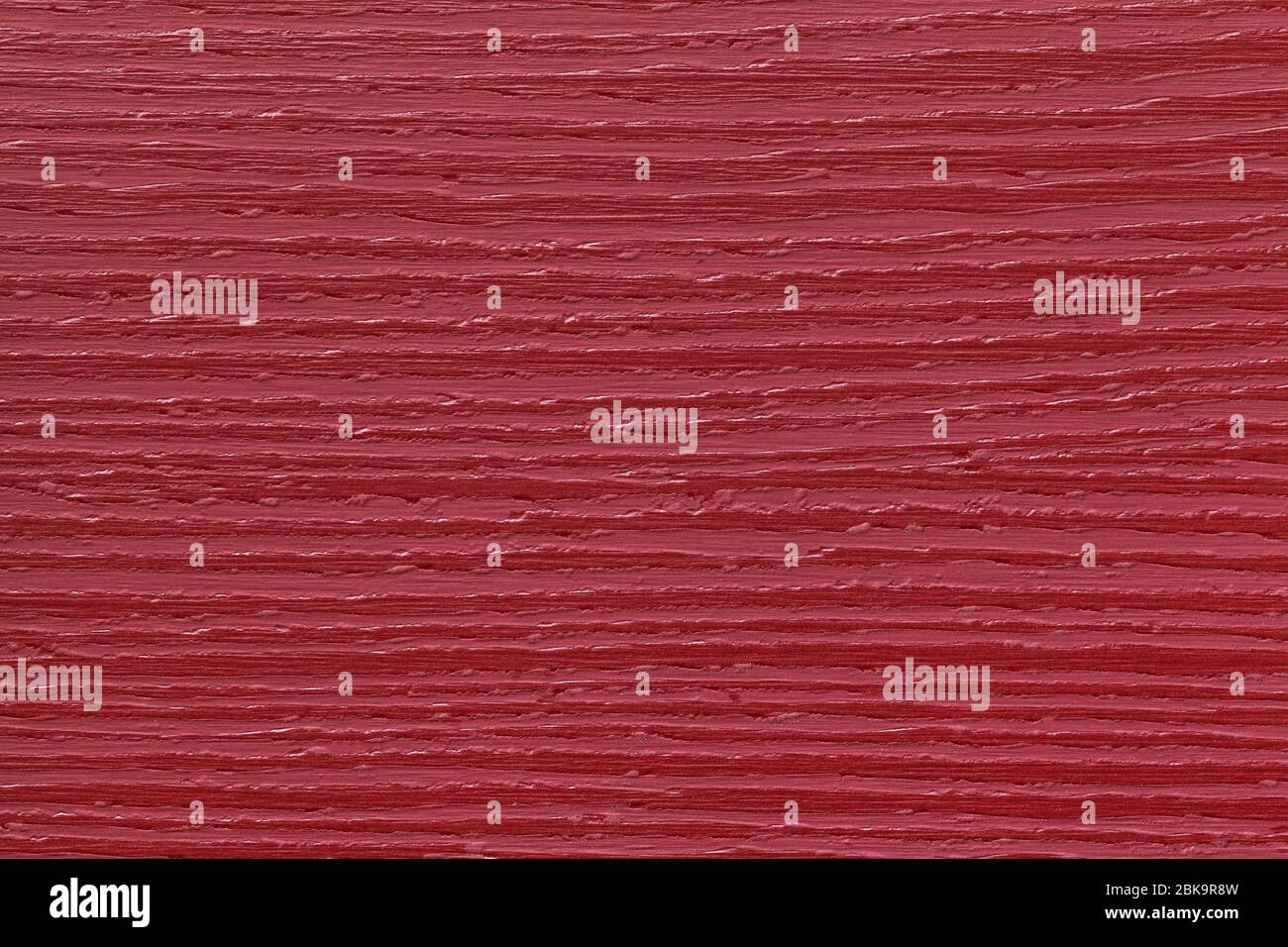 Texture of dark red old decorative panel, plastic material with wooden