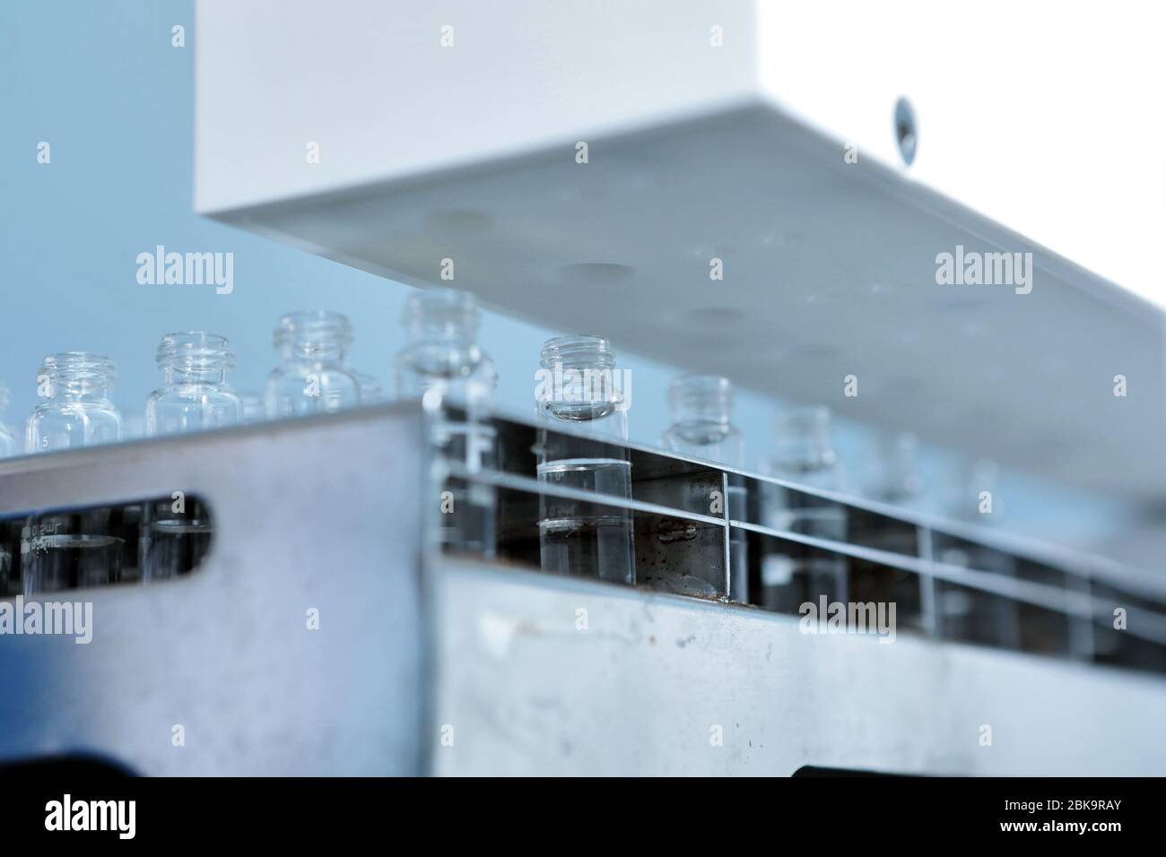 Sterile bottles and ampoules on the dispensing line. Sealed ampoules