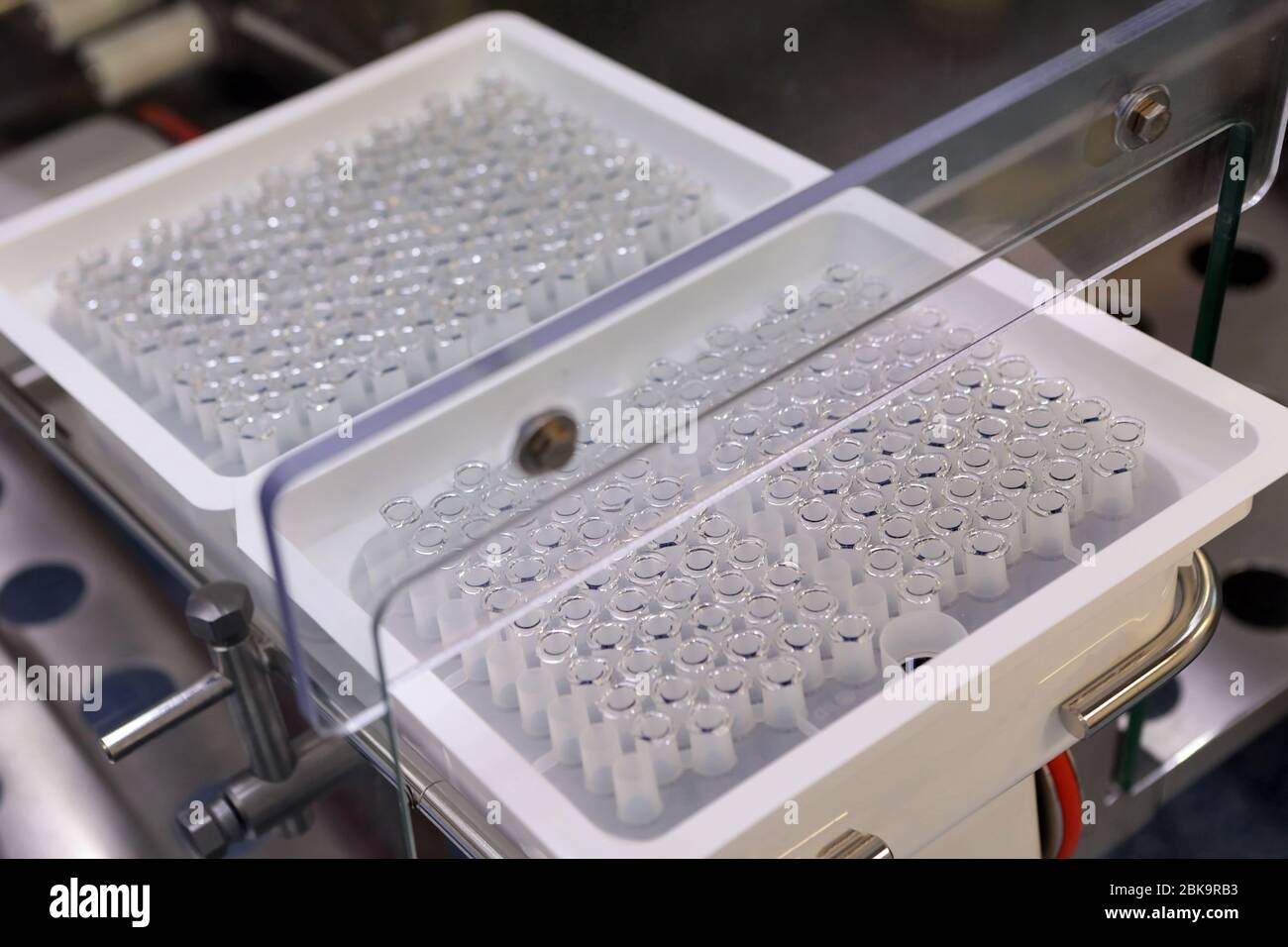 Sterile bottles and ampoules on the dispensing line. Sealed ampoules