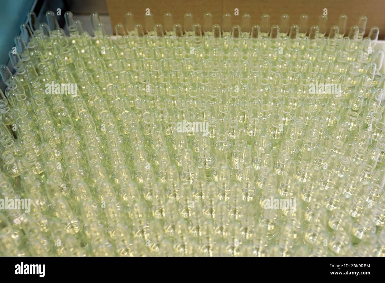 Sterile bottles and ampoules on the dispensing line. Sealed ampoules