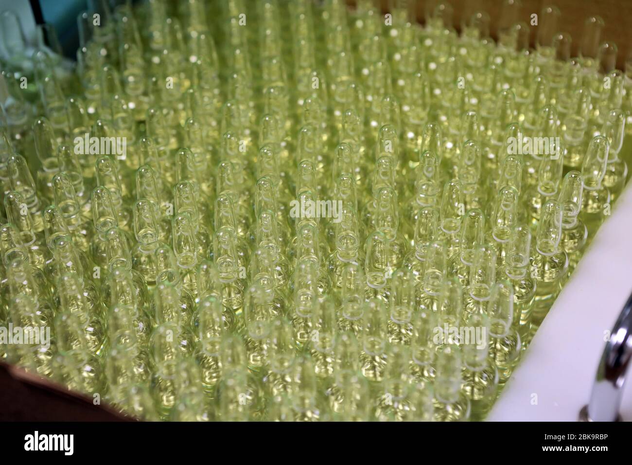 Sterile bottles and ampoules on the dispensing line. Sealed ampoules