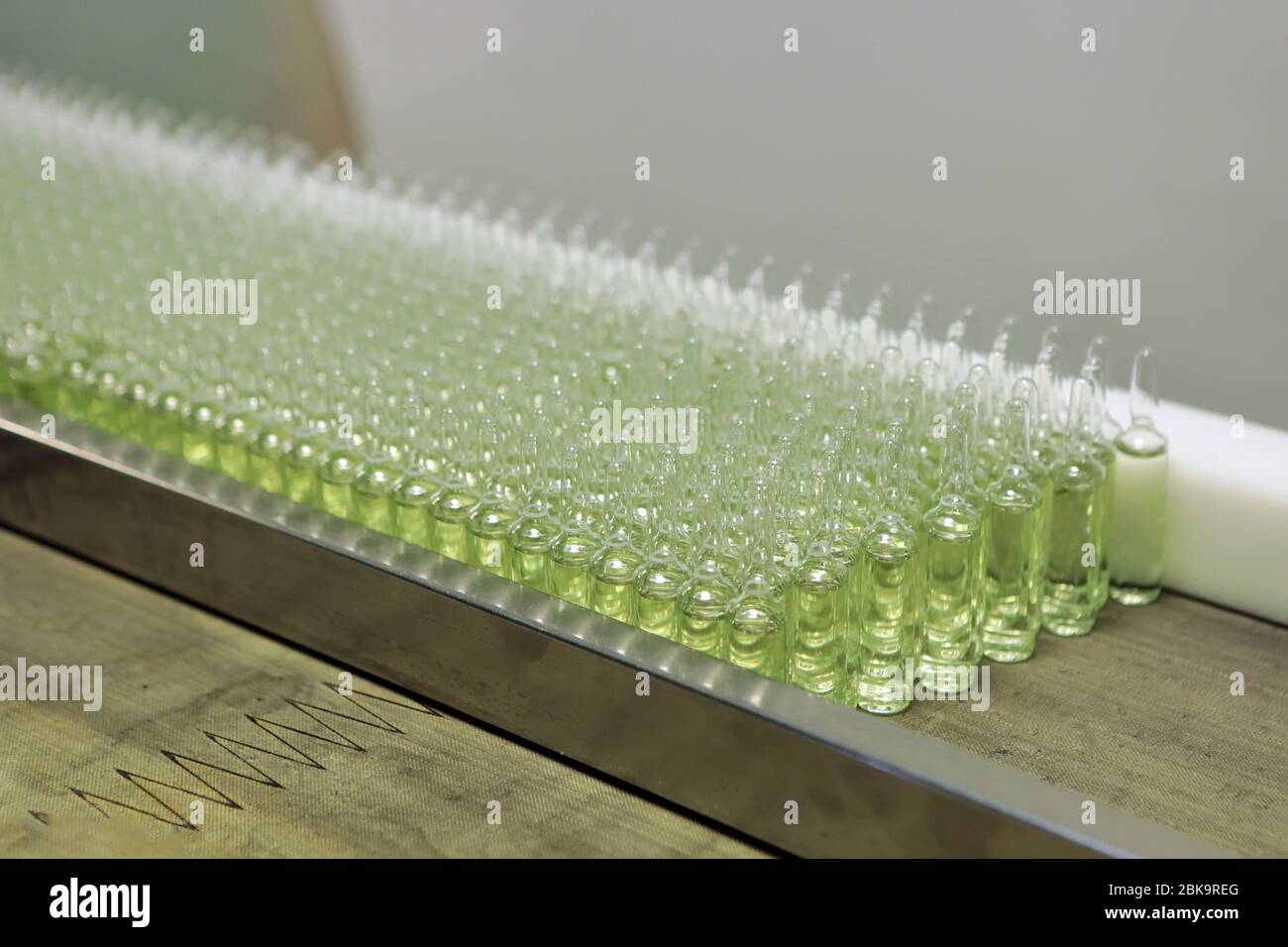 Sterile bottles and ampoules on the dispensing line. Sealed ampoules