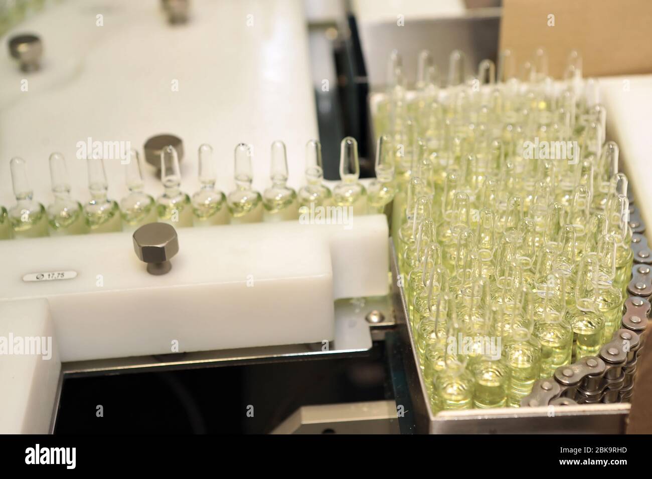 Sterile bottles and ampoules on the dispensing line. Sealed ampoules