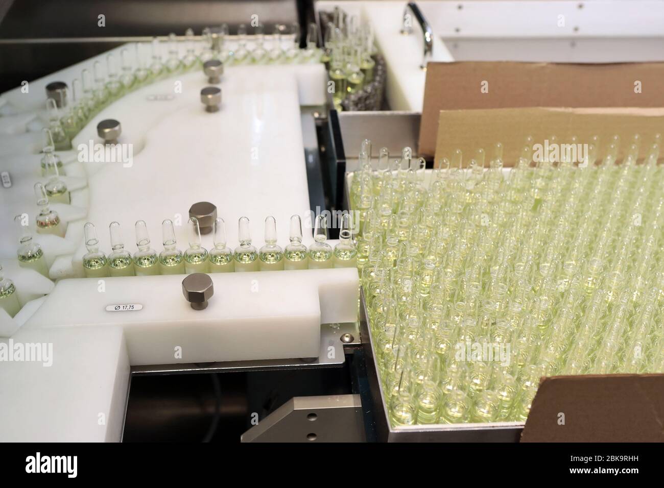 Sterile bottles and ampoules on the dispensing line. Sealed ampoules