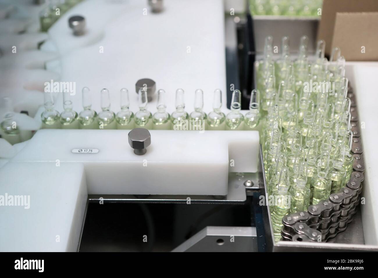 Sterile bottles and ampoules on the dispensing line. Sealed ampoules