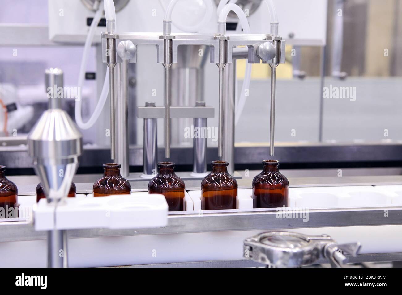 Sterile bottles and ampoules on the dispensing line. Sealed ampoules