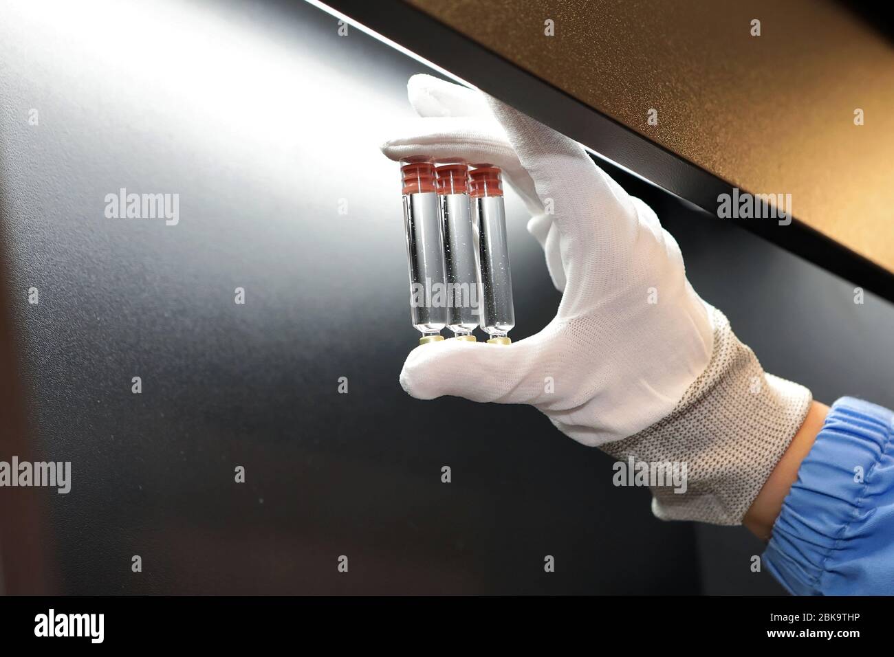 Quality Control vials for injection. Individual checks vial under a microscope. New