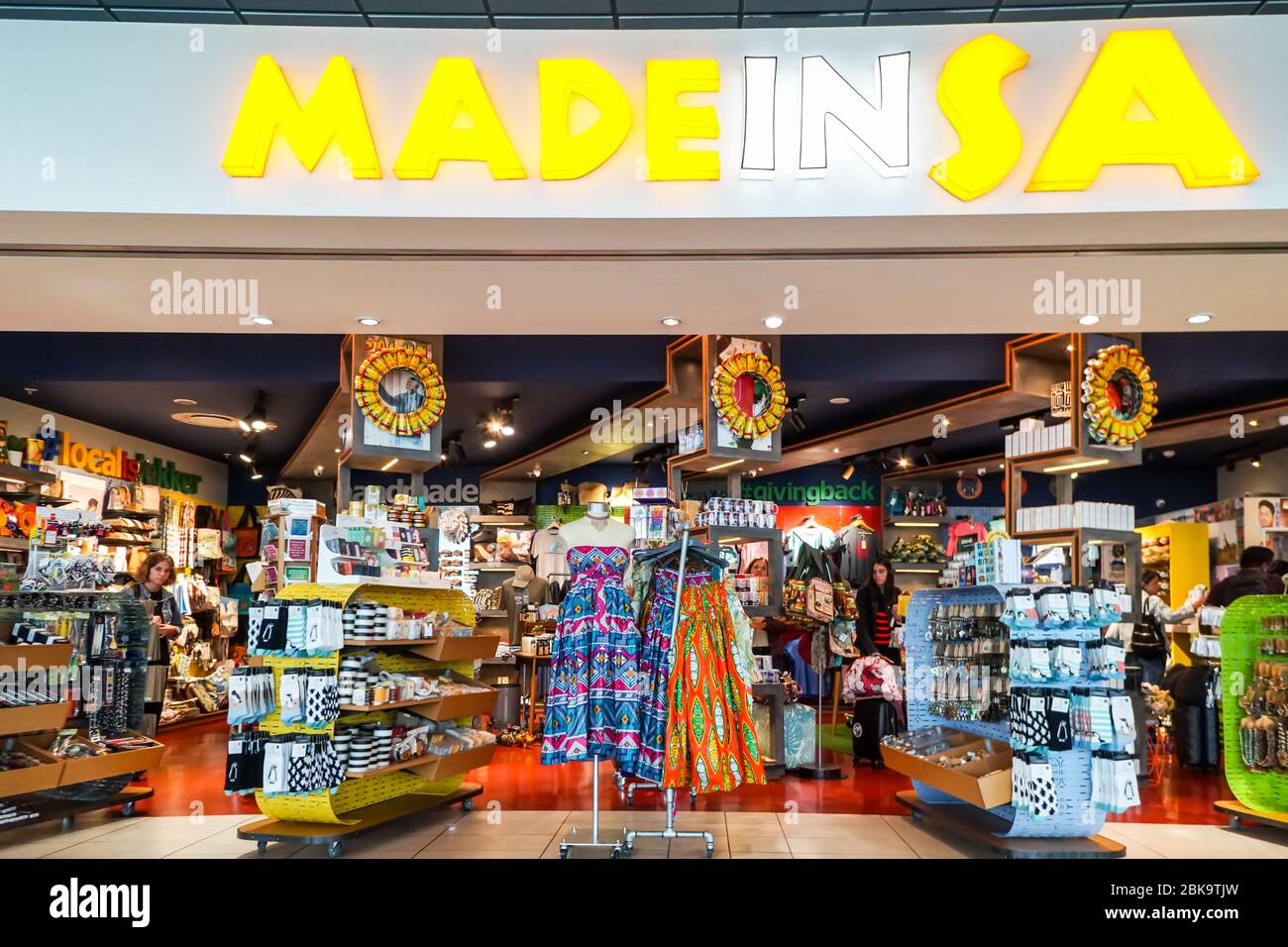 shoppers, people browsing in an airport store, shop for gifts, curios, mementos, souvenirs at Cape Town International airport, South Africa Stock Photo