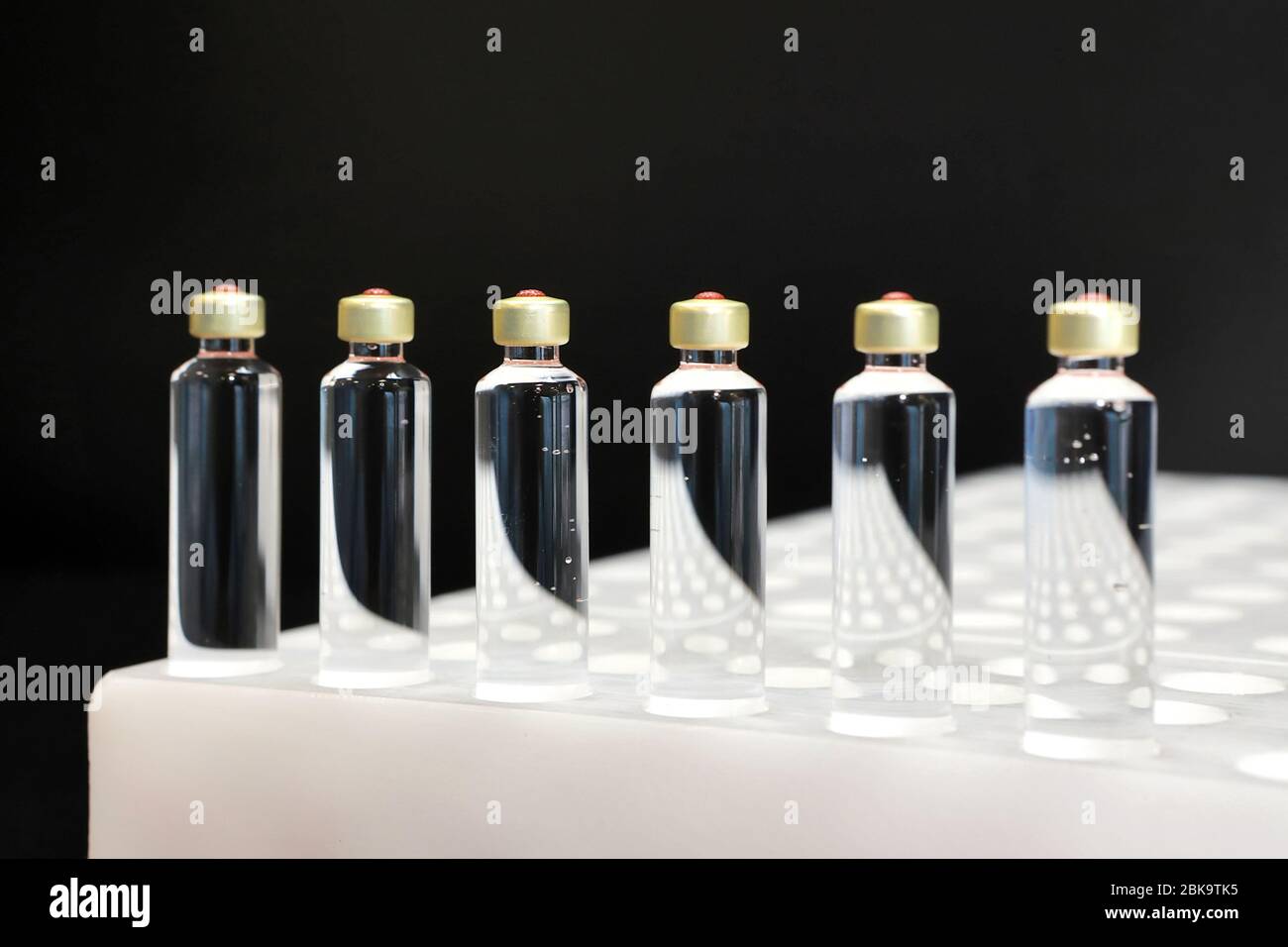 Quality Control vials for injection. Individual checks vial under a microscope. New