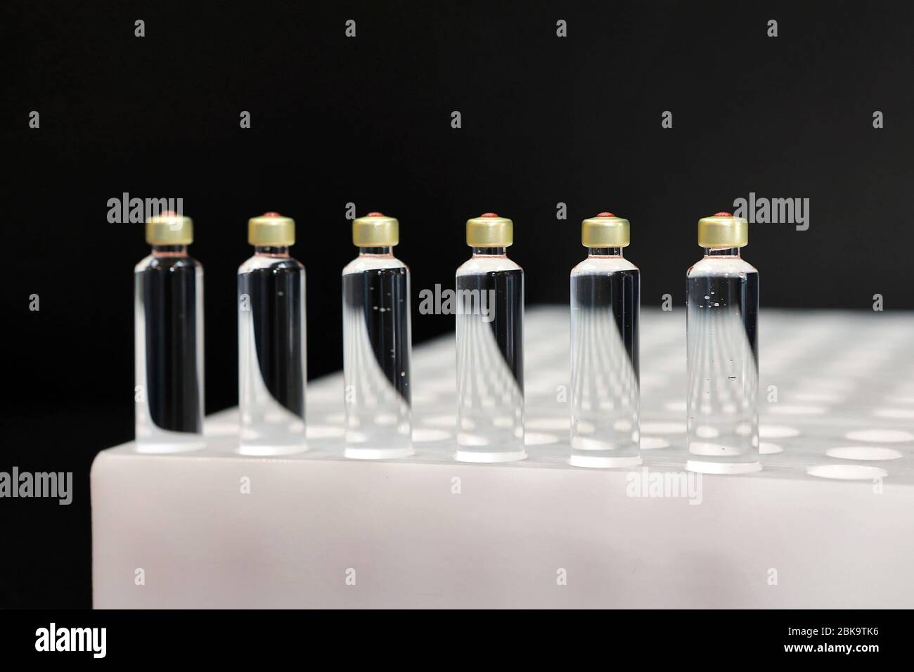 Quality Control vials for injection. Individual checks vial under a microscope. New