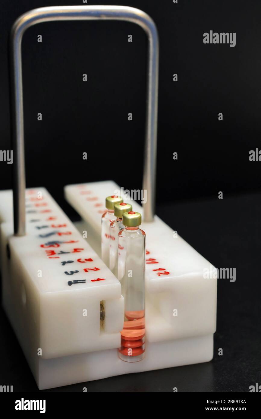 Quality Control vials for injection. Individual checks vial under a