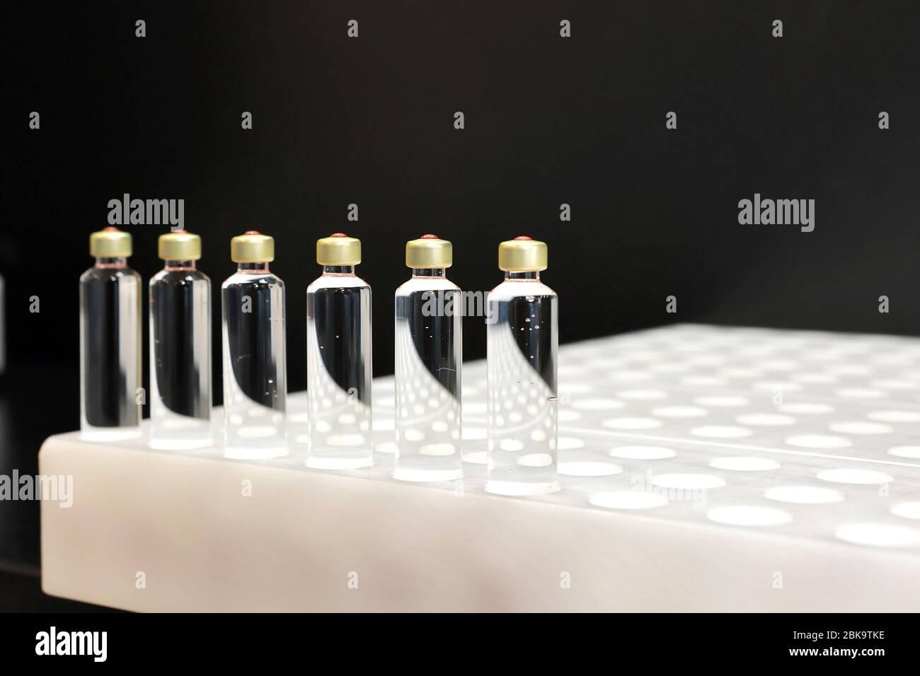 Quality Control vials for injection. Individual checks vial under a microscope. New