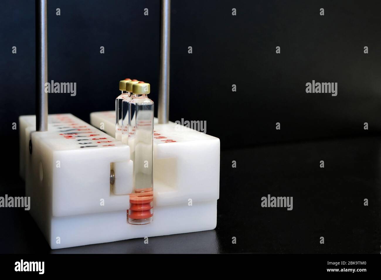 Quality Control vials for injection. Individual checks vial under a microscope. New