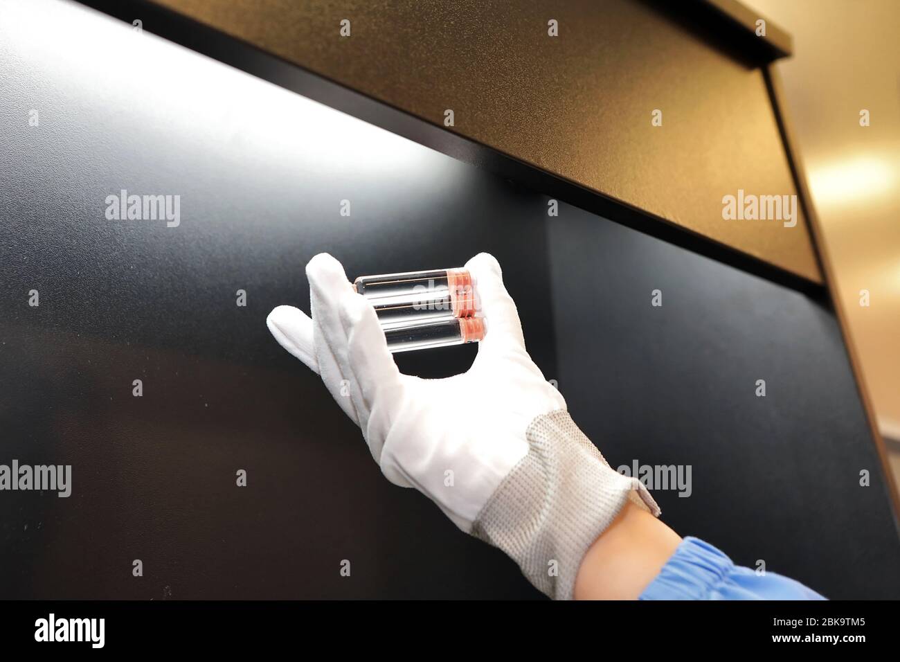 Quality Control vials for injection. Individual checks vial under a microscope. New