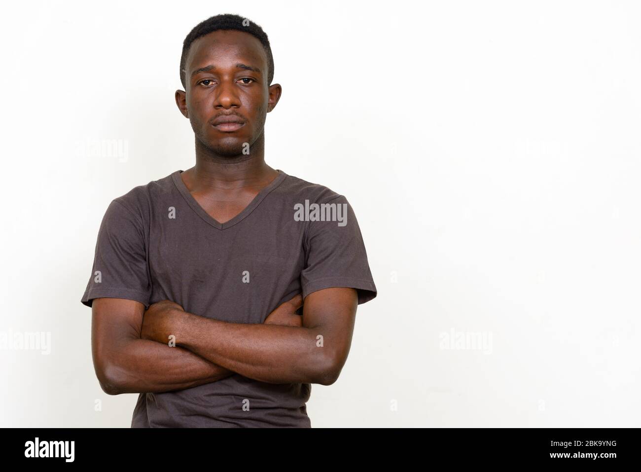 Portrait of young African man with arms crossed Stock Photo - Alamy