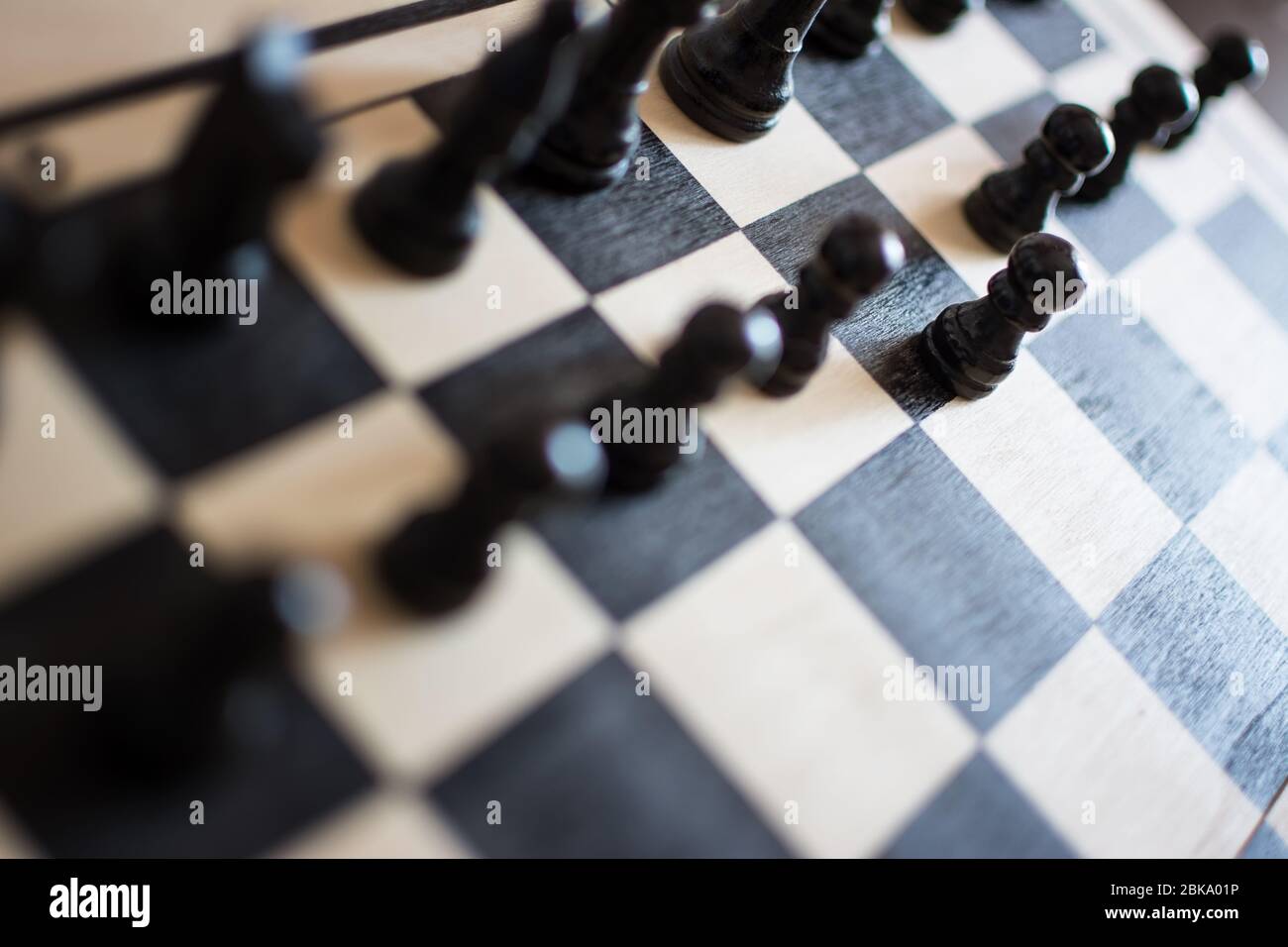 Chess pieces on the chess board with selective focus and crop fragment. Business and motivation concept. Stock Photo