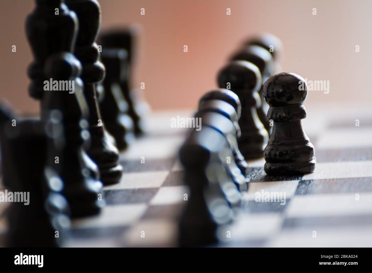 Chess pieces on the chess board with selective focus and crop fragment. Business and motivation concept. Stock Photo