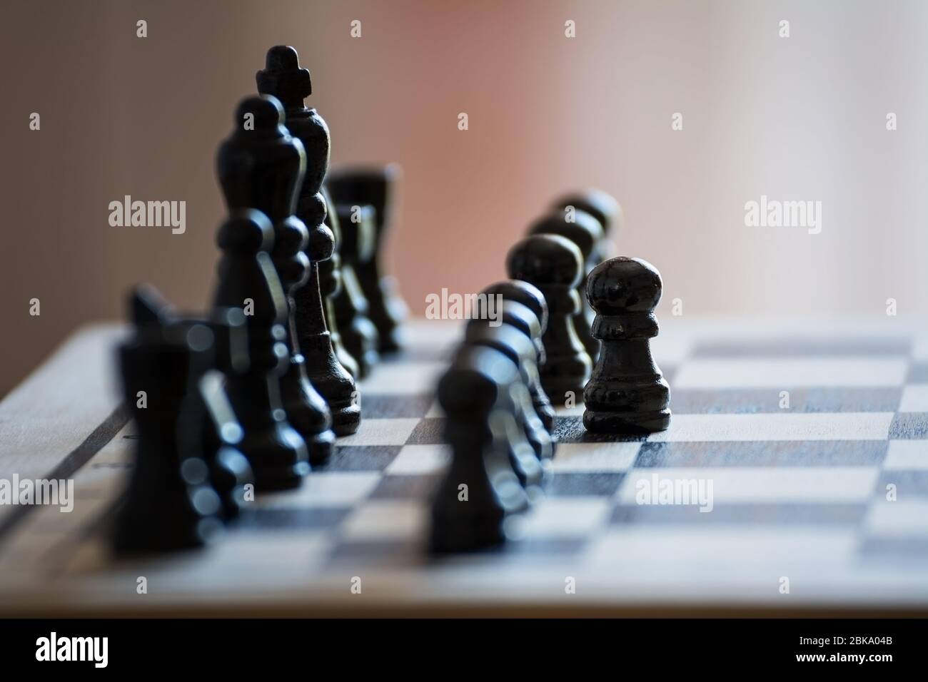Chess pieces on the chess board with selective focus and crop fragment. Business and motivation concept. Copy space Stock Photo