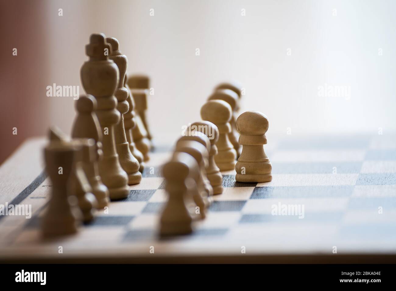 Chess pieces on the chess board with selective focus and crop fragment. Business and motivation concept. Copy space Stock Photo